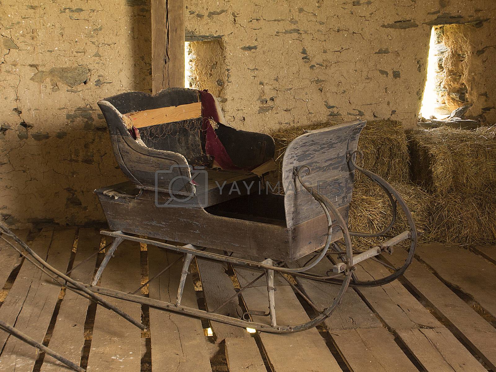 Royalty free image of Horse-drawn sleigh in barn by CharlieFloyd