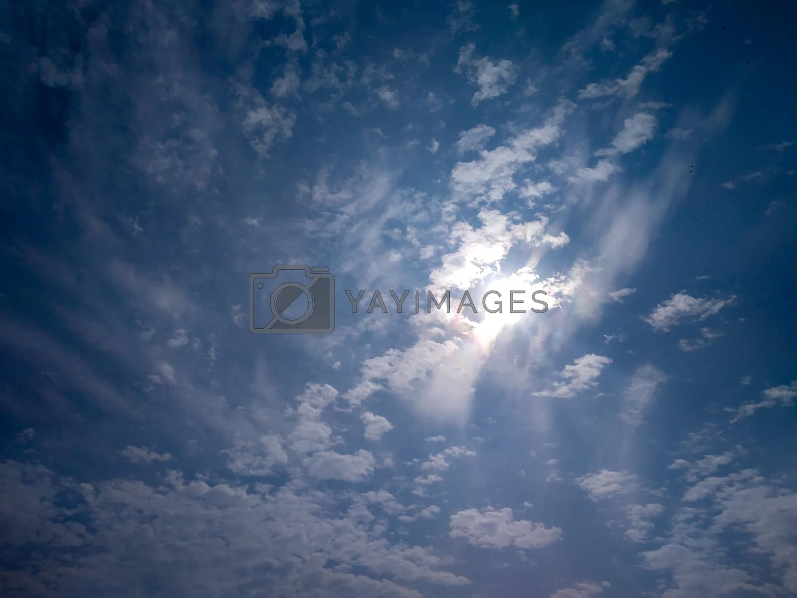 Royalty free image of Dramatic blue sky and clouds sunbeam by iampbharti