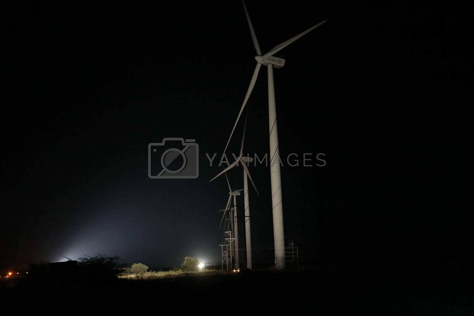 Royalty free image of windmill rotating in Farm by rajastills