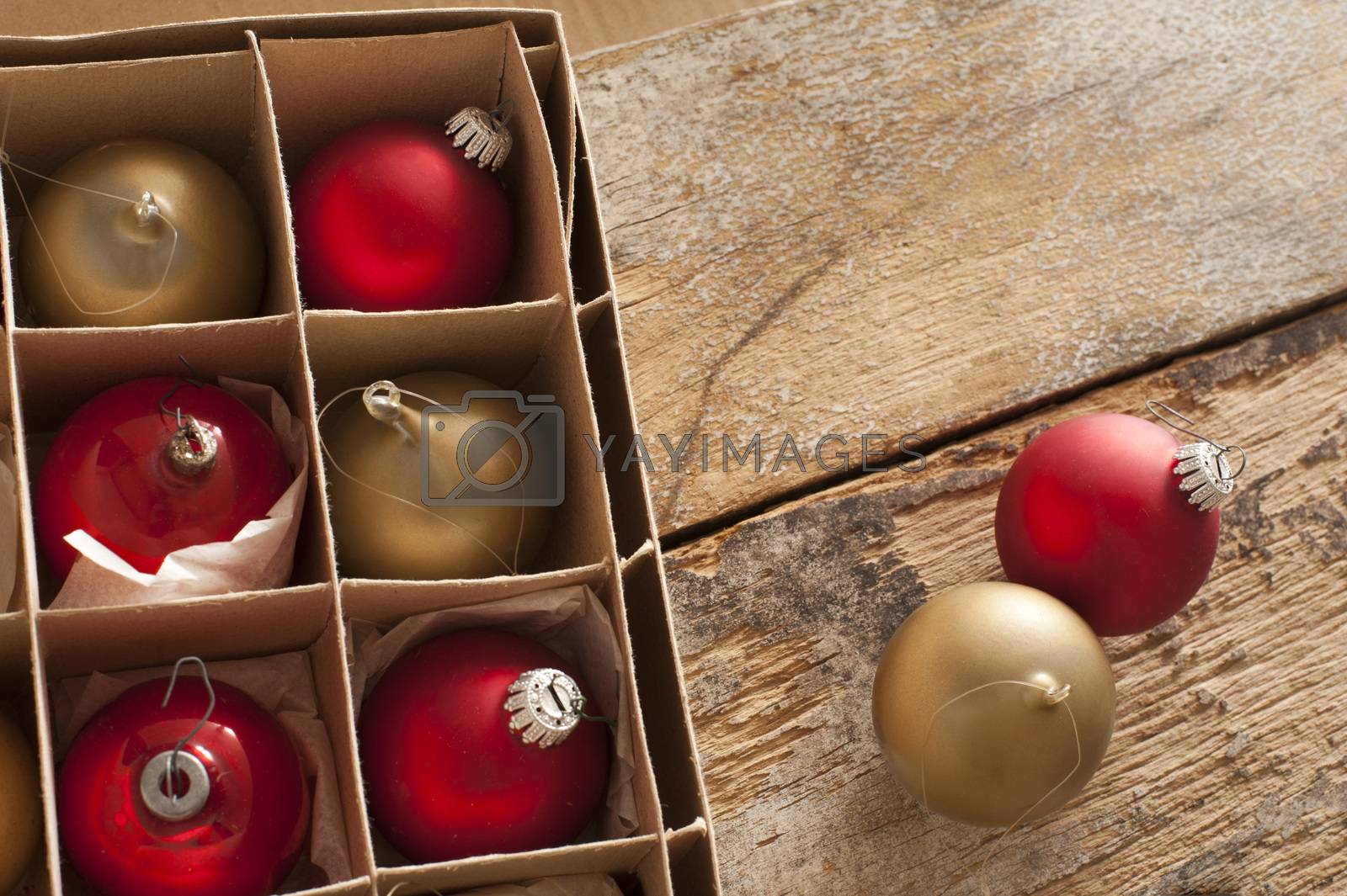 Royalty free image of Boxed red and gold Christmas baubles by stockarch