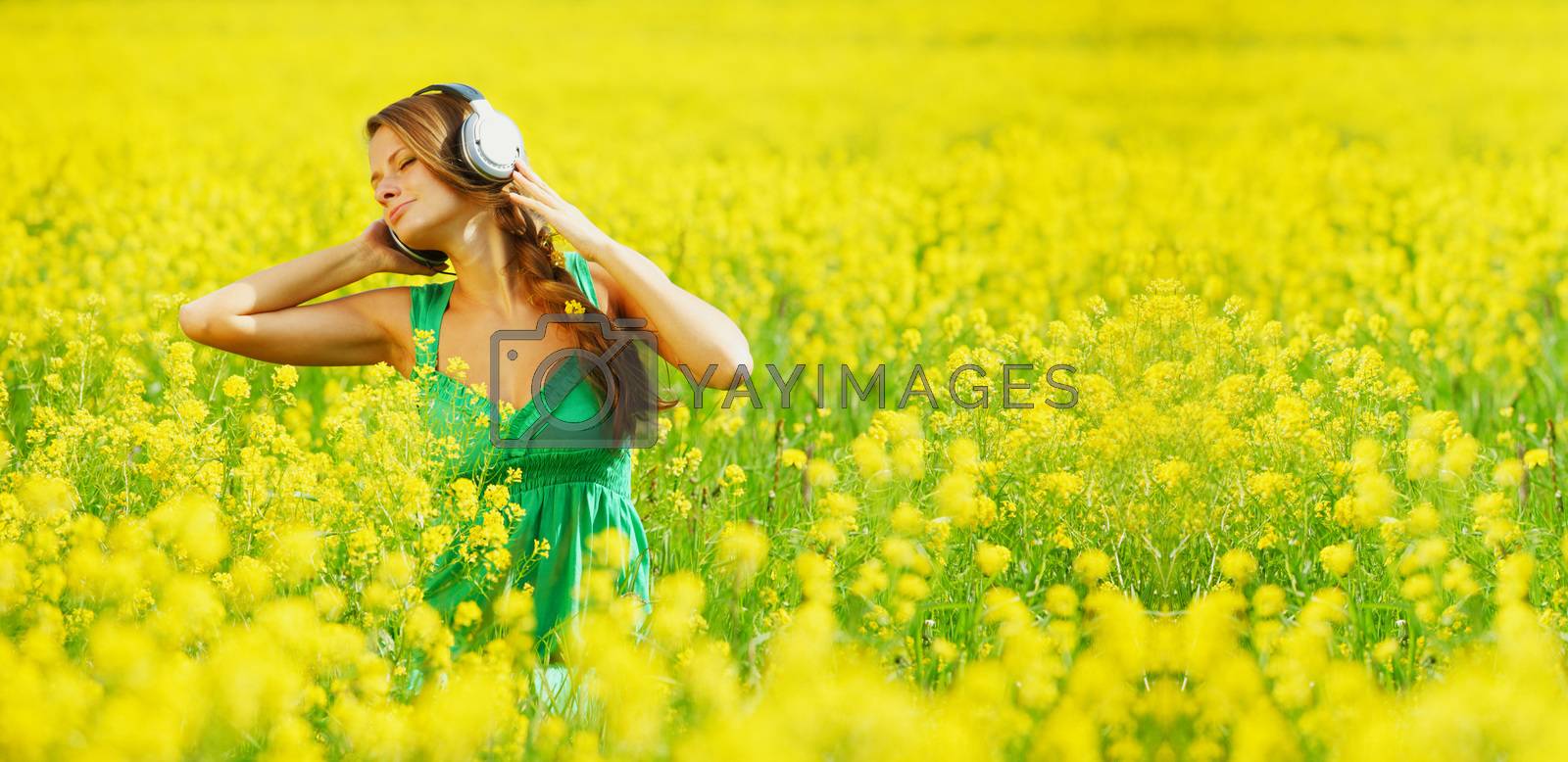 Royalty free image of listening to music by Yellowj