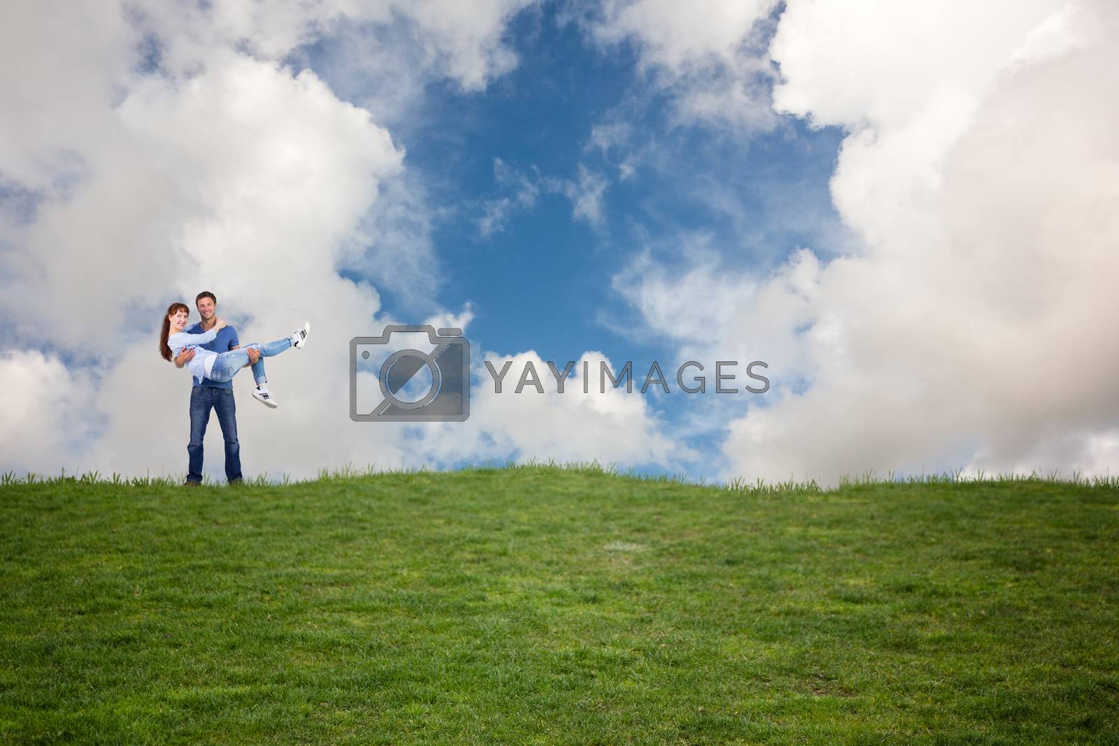 Royalty free image of Composite image of man lifting up his girlfriend by Wavebreakmedia