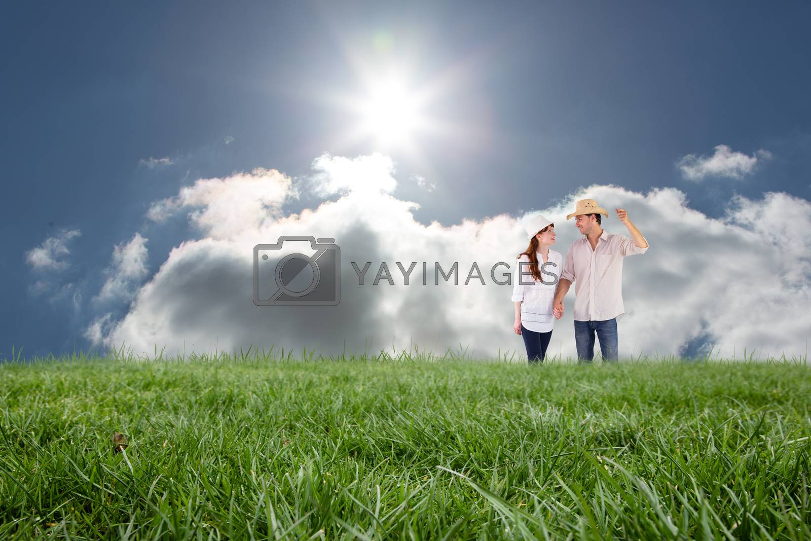 Royalty free image of Composite image of smiling couple both wearing hats by Wavebreakmedia