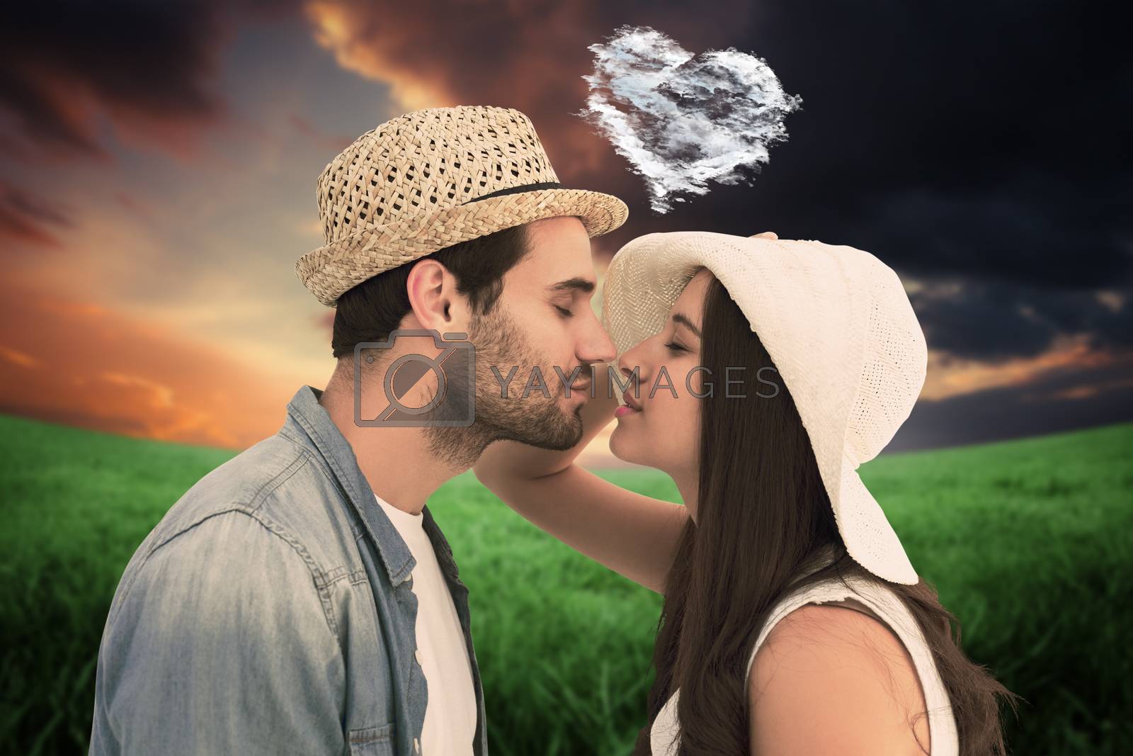 Royalty free image of Composite image of happy hipster couple about to kiss by Wavebreakmedia