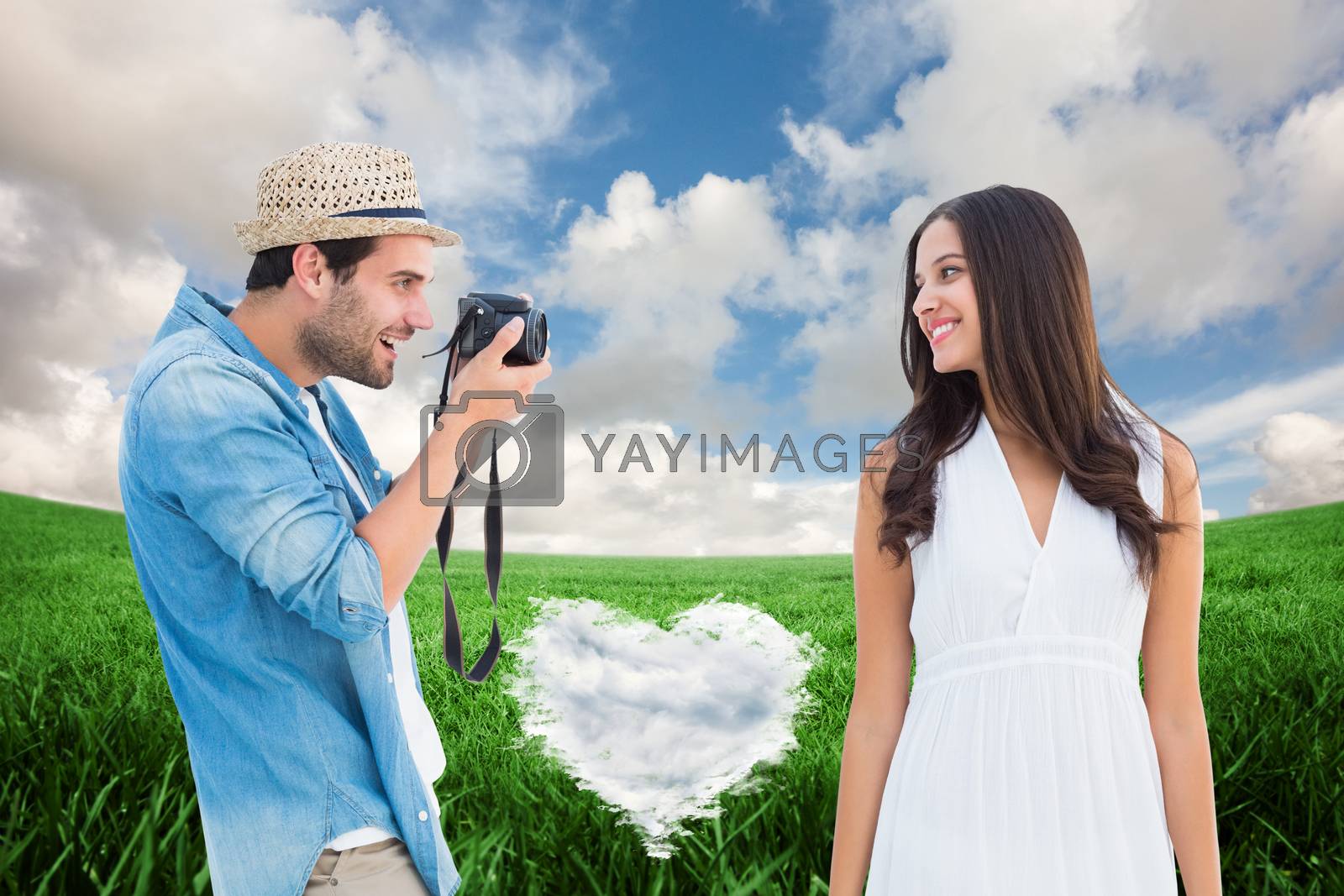 Royalty free image of Composite image of handsome hipster taking a photo of pretty girlfriend by Wavebreakmedia