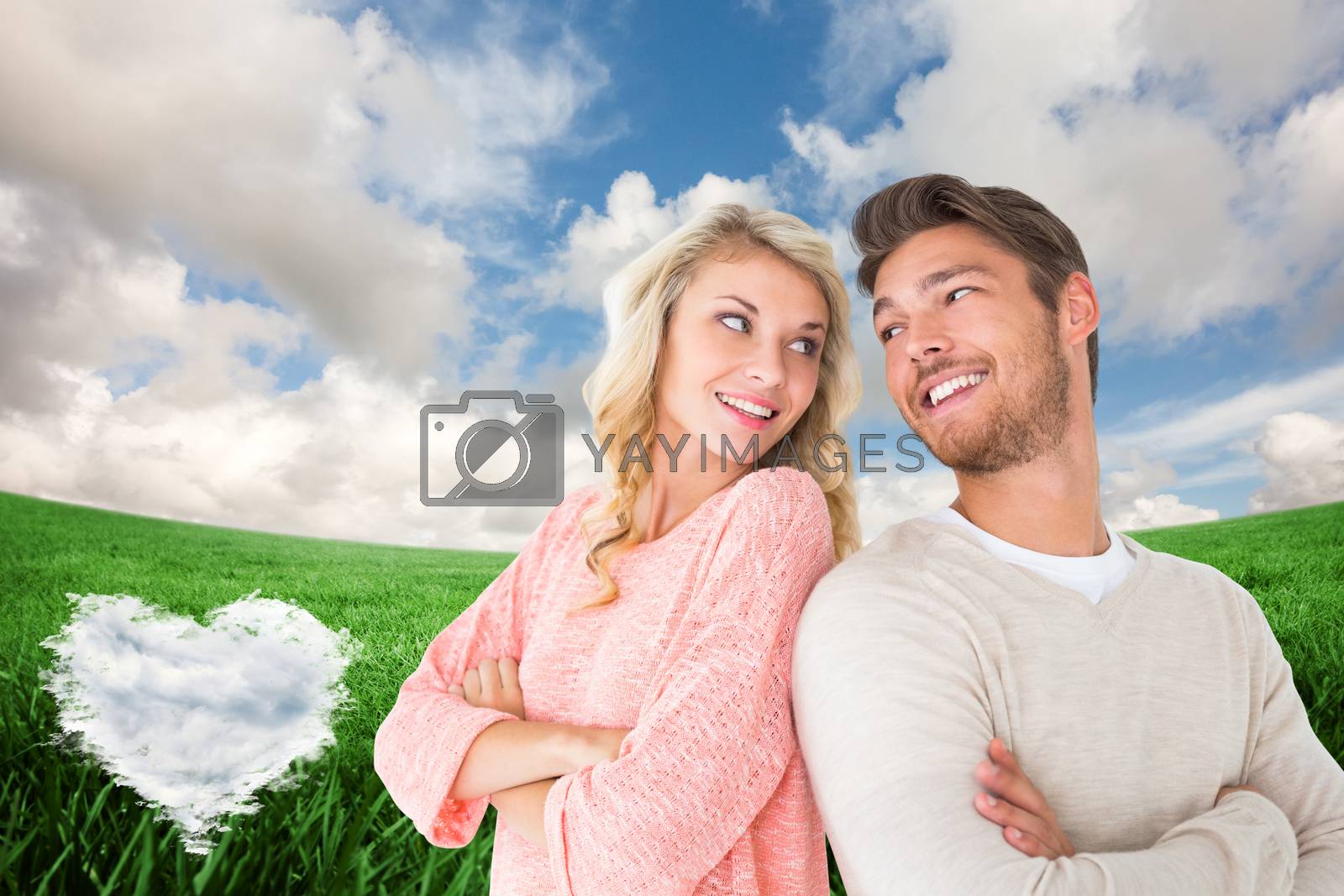 Royalty free image of Composite image of attractive couple smiling with arms crossed by Wavebreakmedia