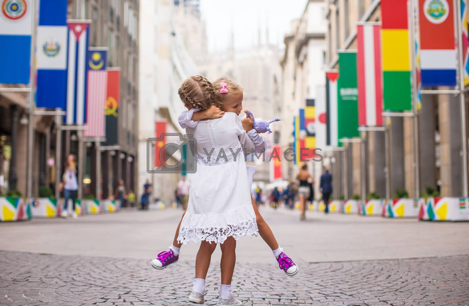 Royalty free image of Little beautiful girls walking in Milan by travnikovstudio