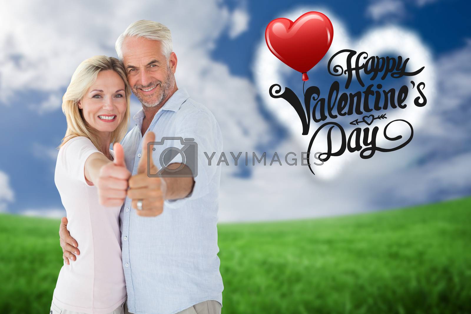 Royalty free image of Composite image of smiling couple showing thumbs up together by Wavebreakmedia