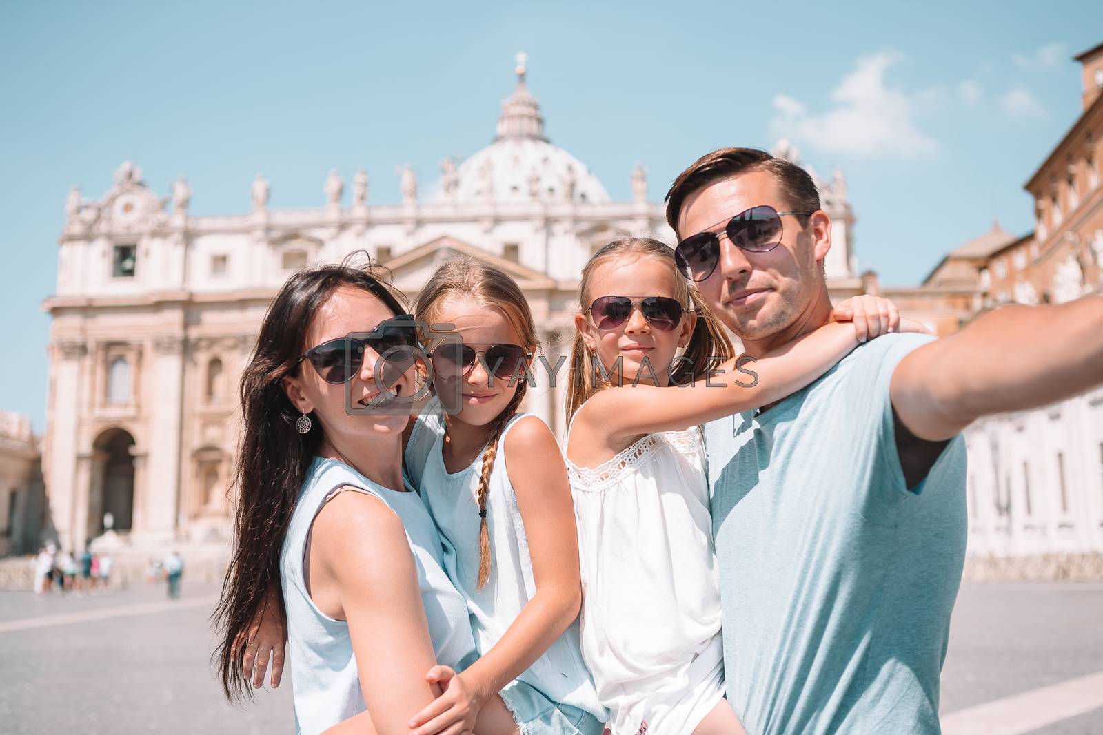 Royalty free image of Happy family taking selfie in Vatican city and St. Peter's Basilica church, Rome, Italy by travnikovstudio