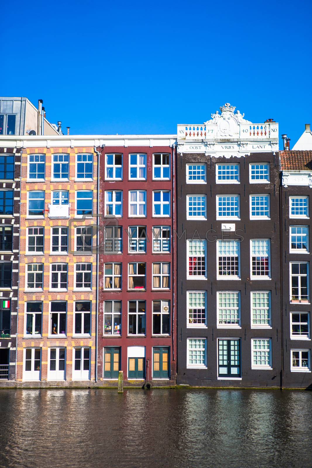 Royalty free image of Traditional dutch medieval houses in Amsterdam capital of Holland by travnikovstudio