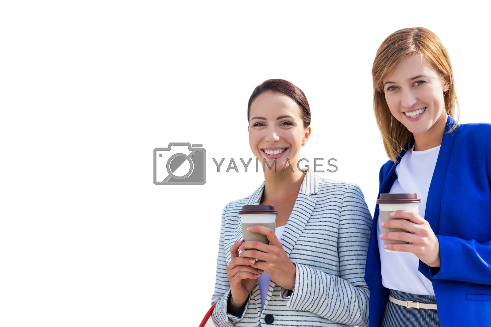 Royalty free image of Cutout of businesswomen holding cup of coffee by moodboard
