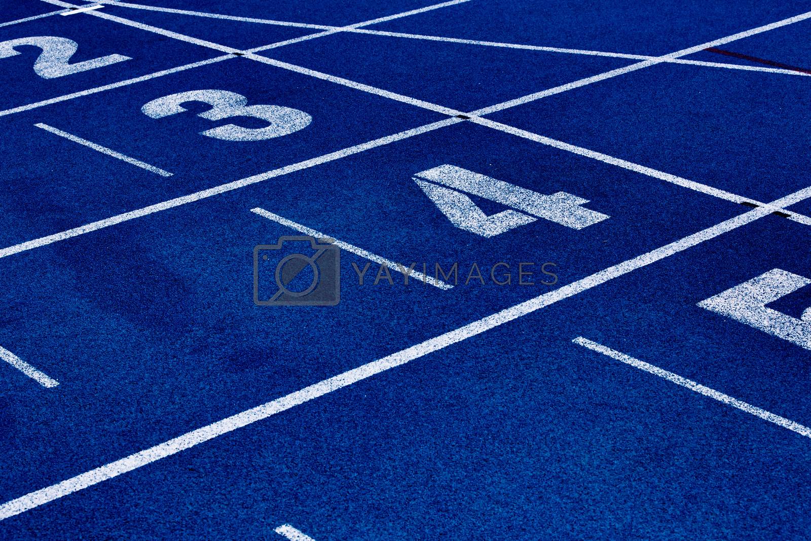 Royalty free image of Close up of 400 meter sprint blue tracking field by moodboard