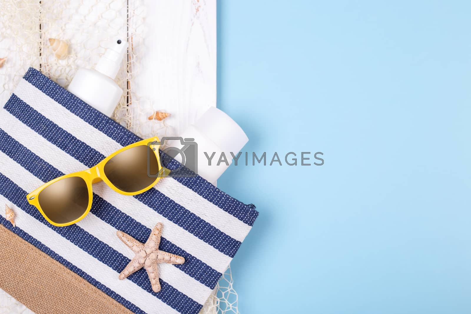 Royalty free image of Beach accessories on the blue background by Lana_M