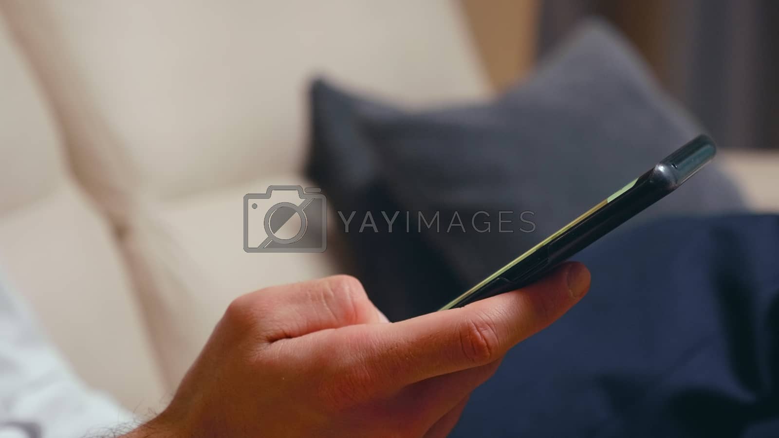 Royalty free image of Close up of businessman browsing on smartphone by DCStudio