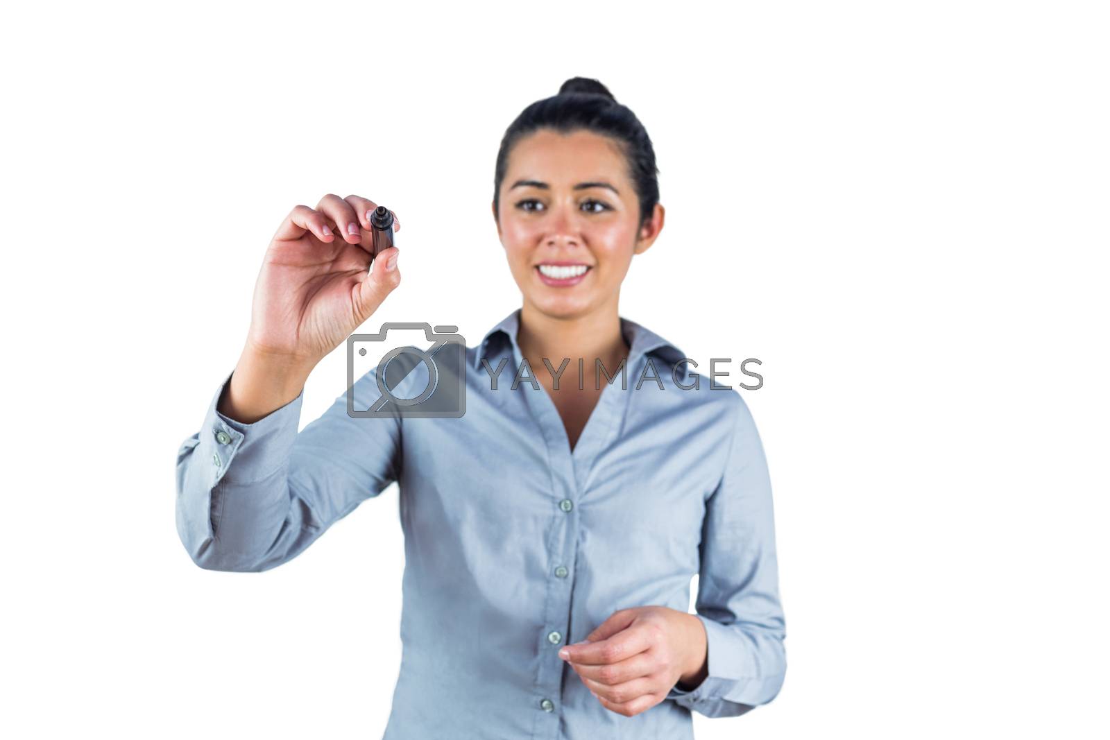 Royalty free image of Woman about to draw with a marker by Wavebreakmedia