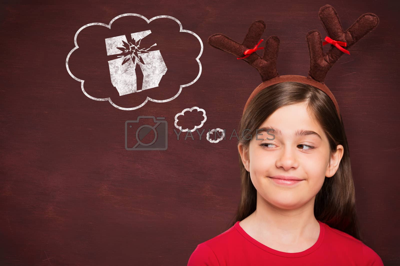 Royalty free image of Composite image of festive little girl wearing antlers by Wavebreakmedia