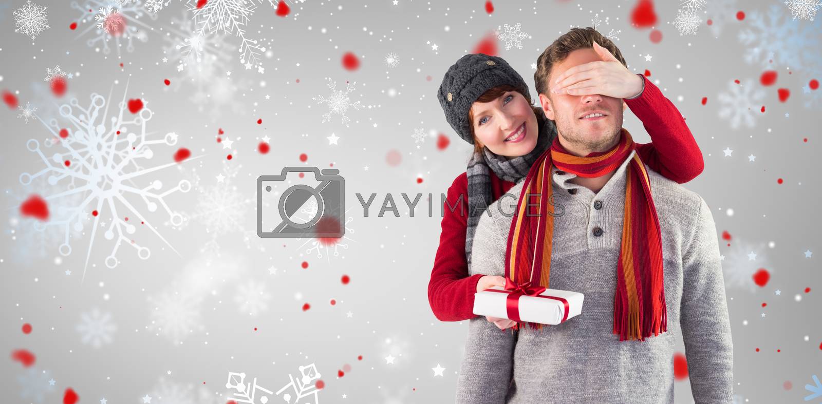 Royalty free image of Composite image of woman giving man a present by Wavebreakmedia