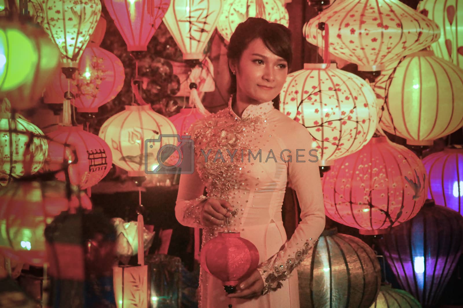 Royalty free image of A Female Vietnamese tourist posing for a photo among the famous Vietnamese lanterns by Sonnet15