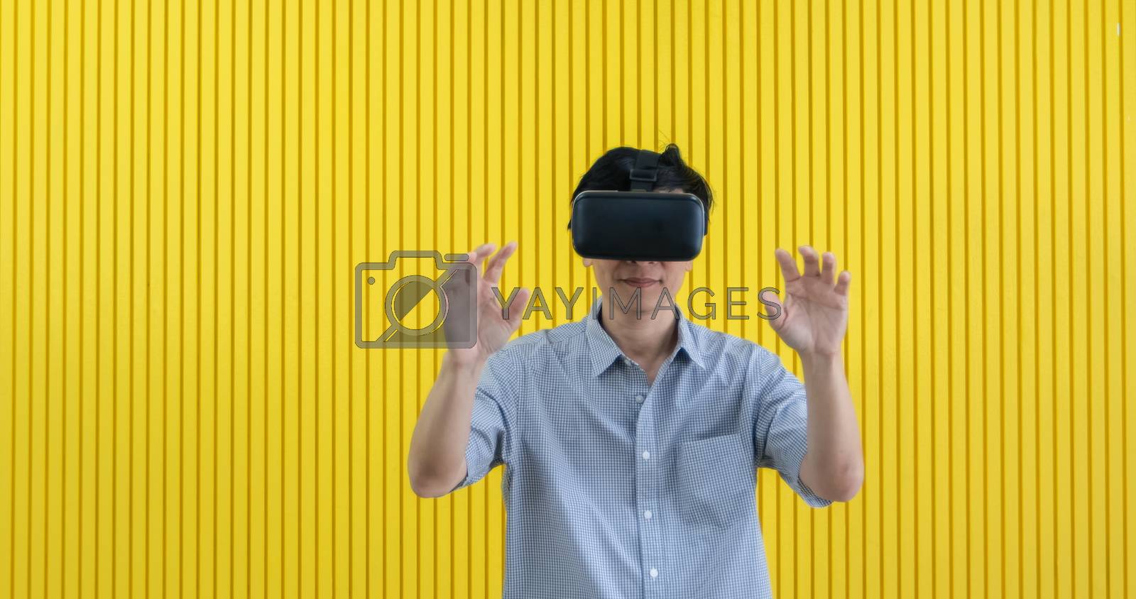 Royalty free image of Senior Asian man using tablet and virtual reality simulator play by Tuiphotoengineer