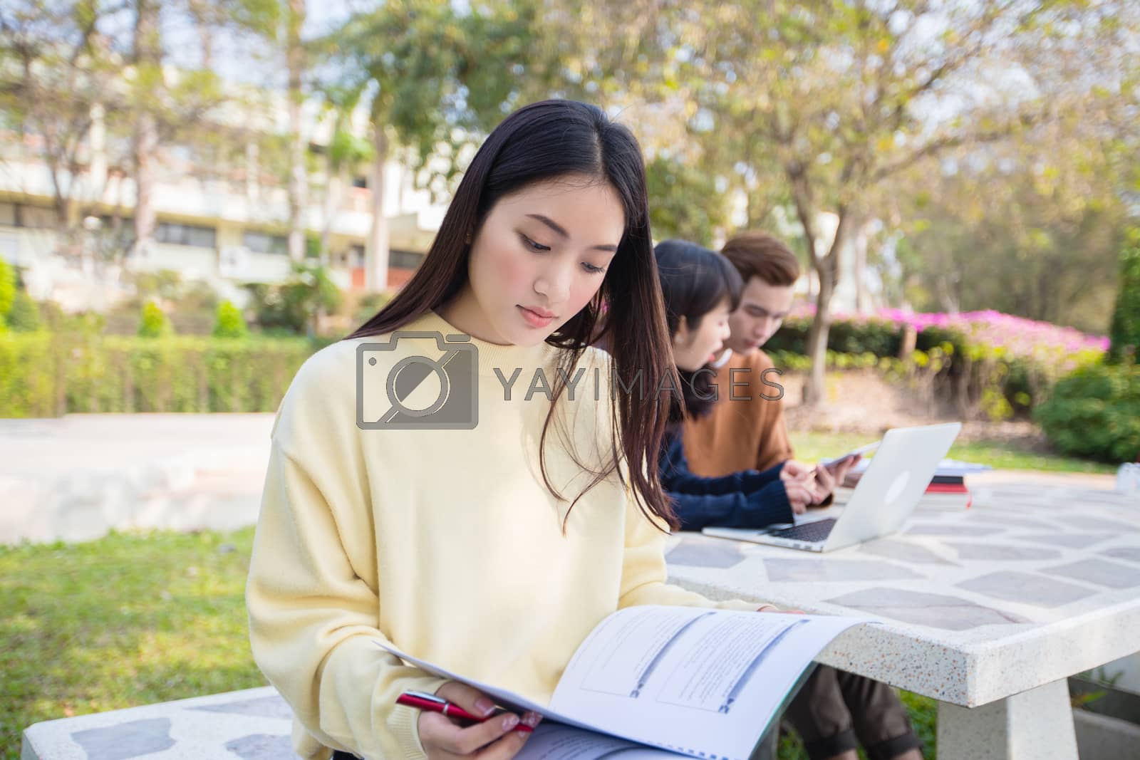 Royalty free image of Asian students use notebook computers and tablet to work and stu by Tuiphotoengineer