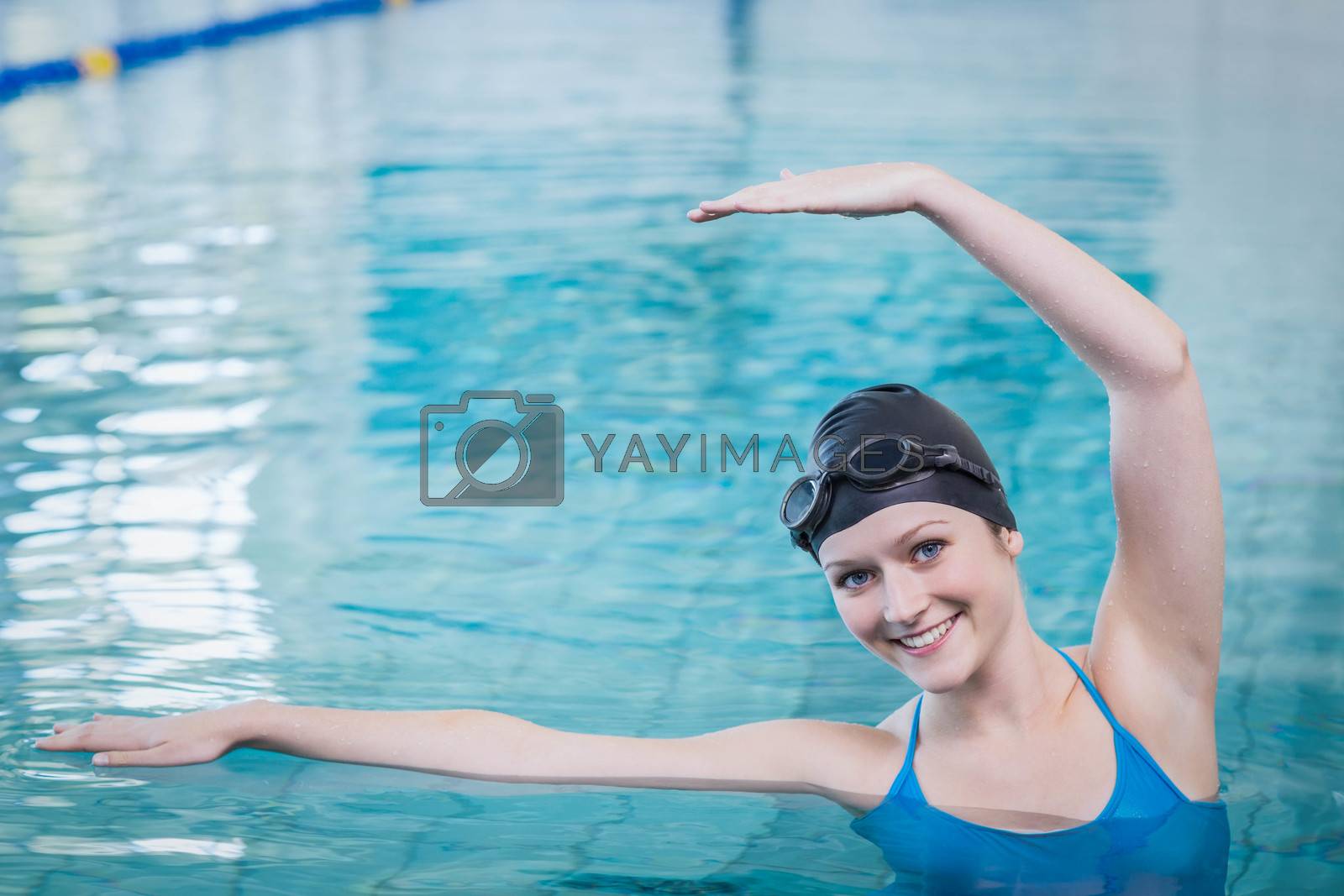 Royalty free image of Fit woman stretching in the water by Wavebreakmedia