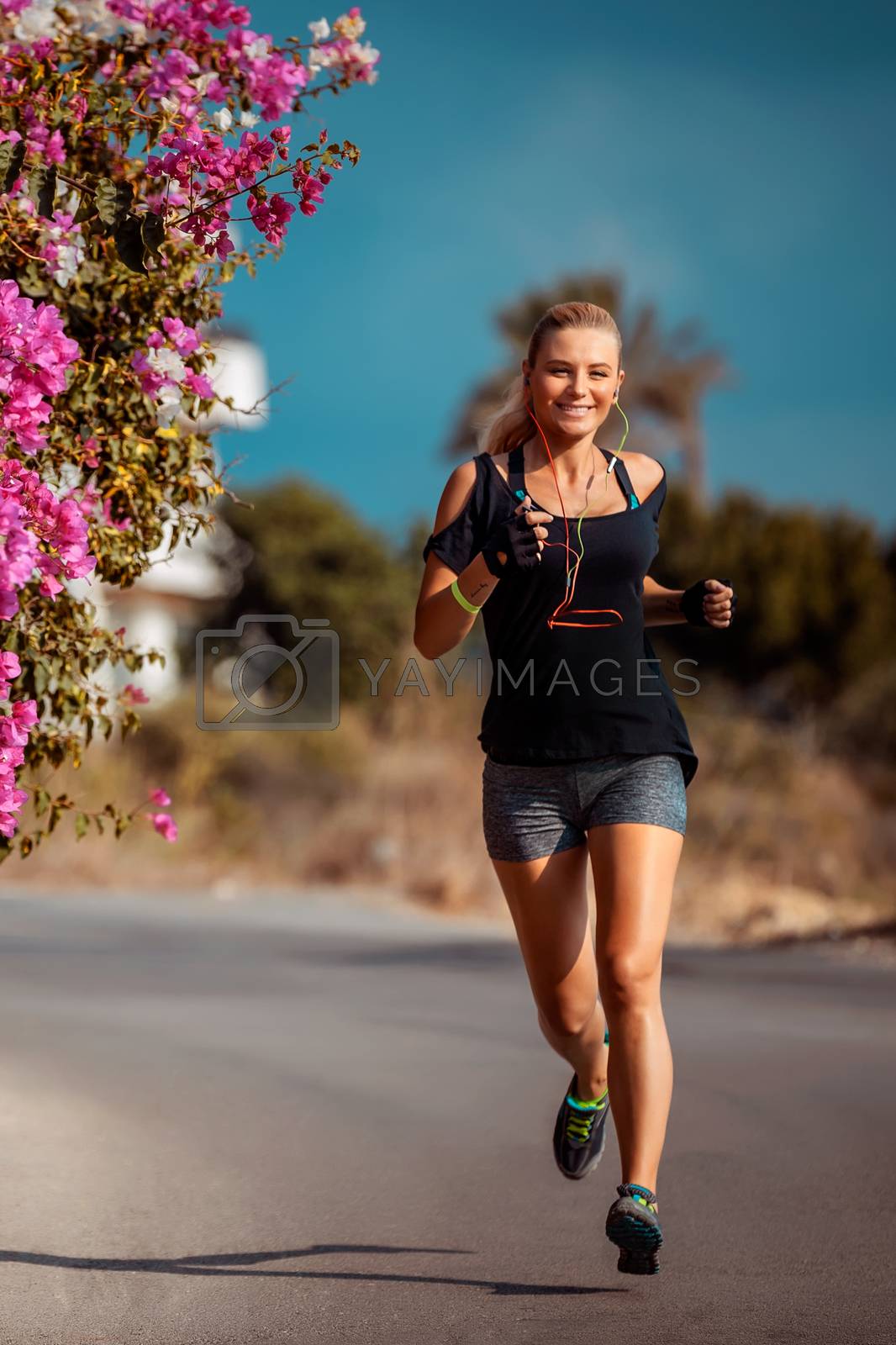 Royalty free image of Happy running woman by Anna_Omelchenko