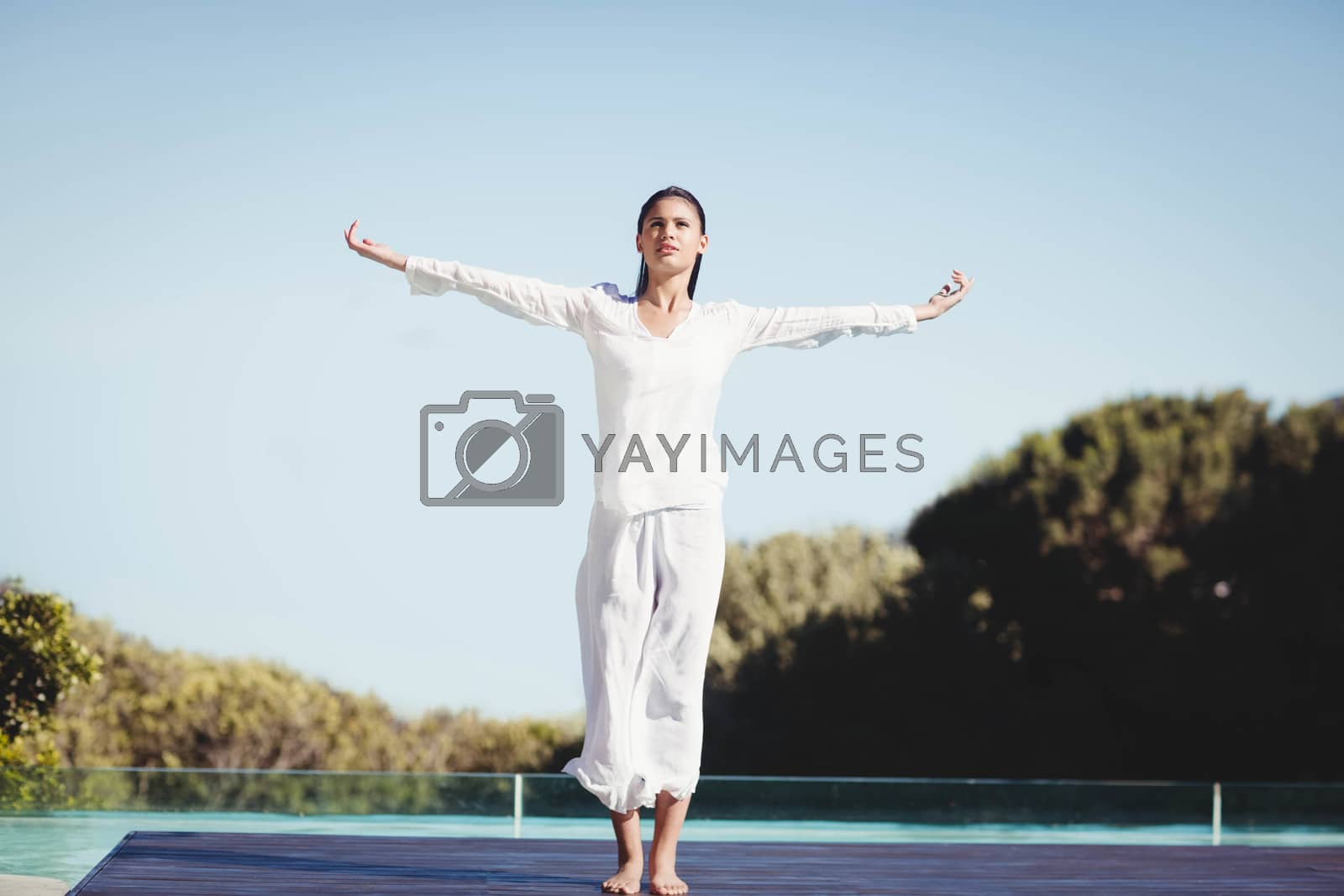 Royalty free image of Calm brunette doing yoga by Wavebreakmedia