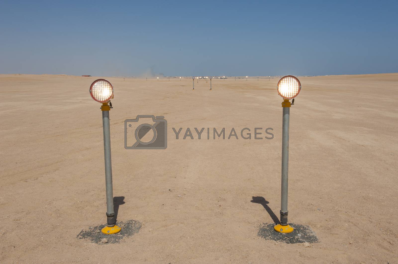 Royalty free image of Approach lights at an airport runway by paulvinten