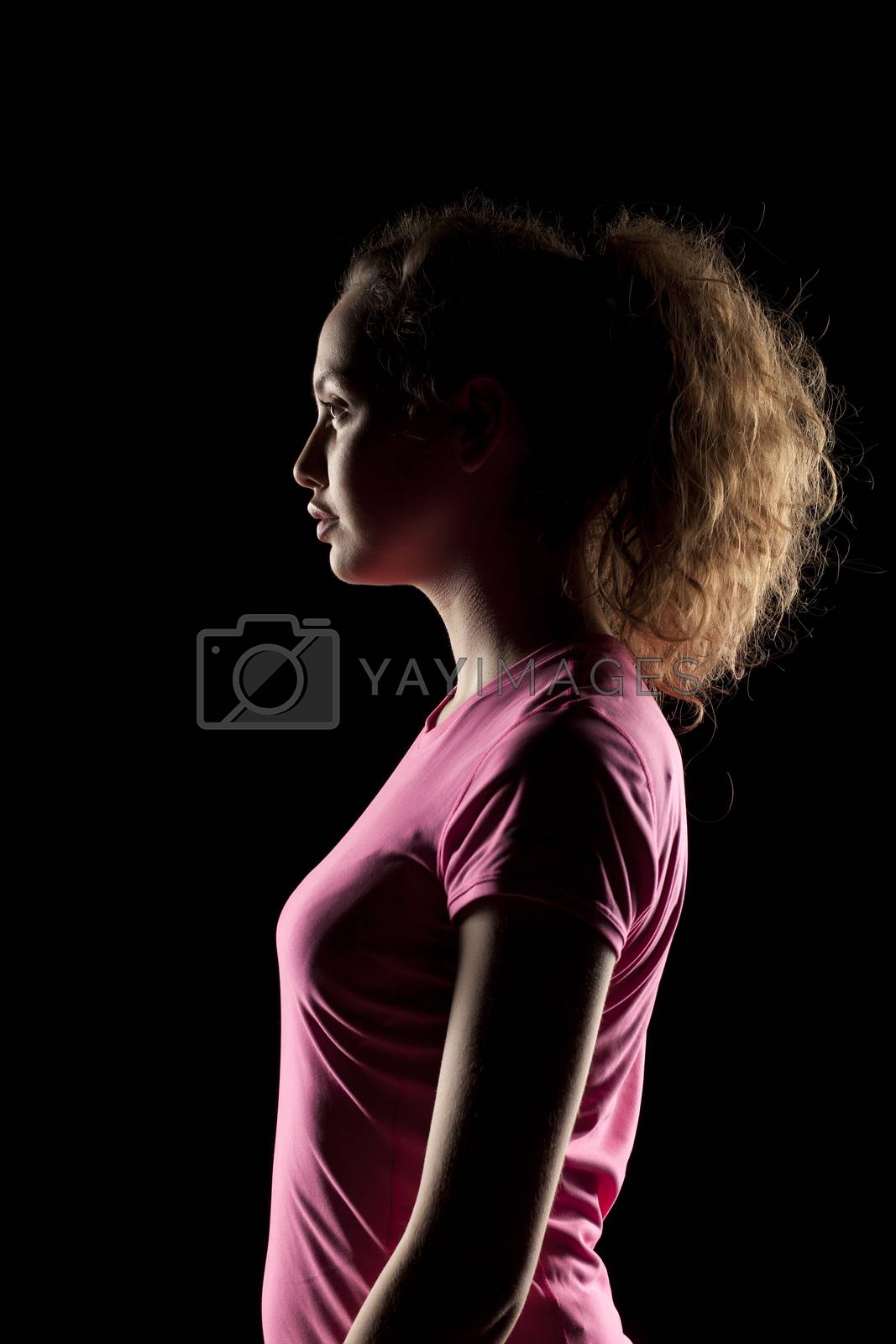 Royalty free image of portrait of a girl with the face in shadow by Vladimirfloyd