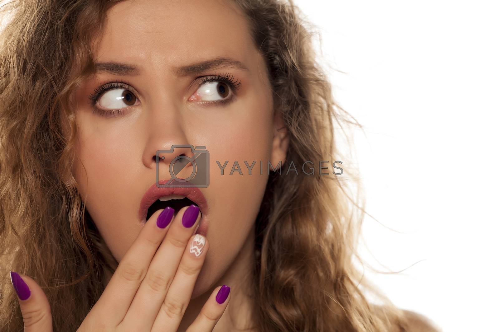 Royalty free image of shocked young woman by Vladimirfloyd