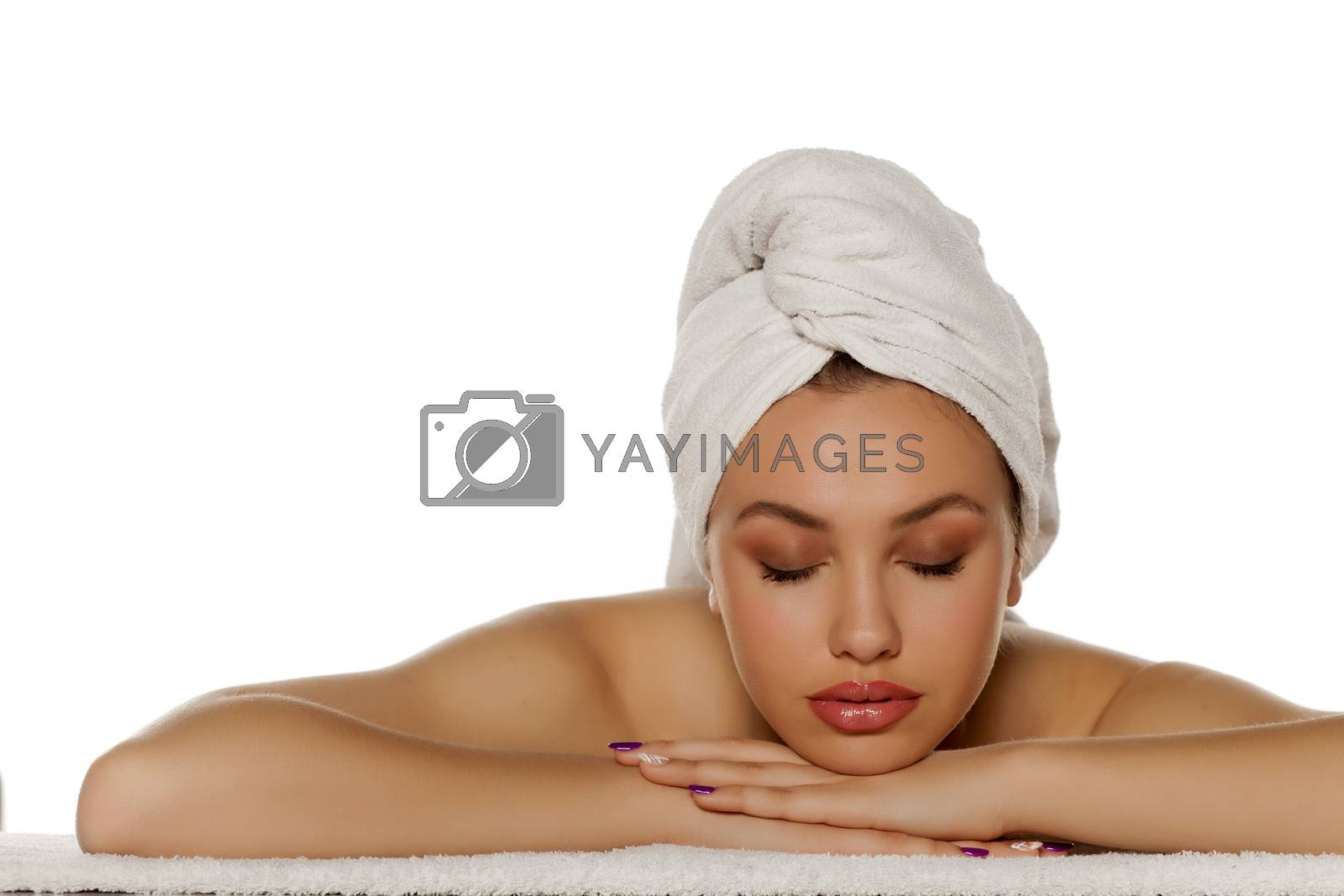 Royalty free image of beautiful young woman lying down on her hands by Vladimirfloyd