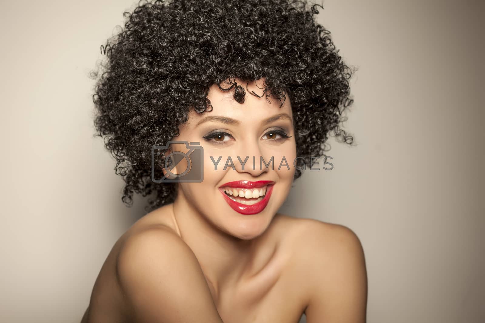 Royalty free image of woman with black curly wig by Vladimirfloyd