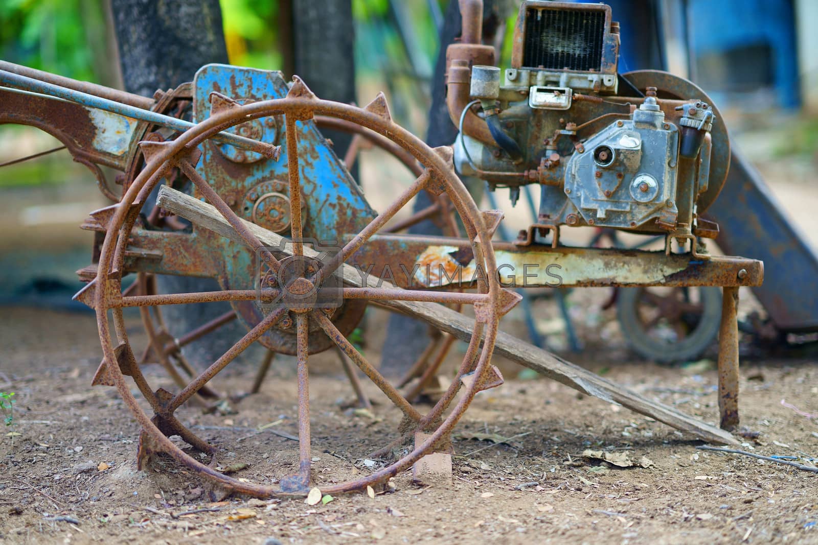 Royalty free image of old tractor for plow farm preparation by VacharapongW