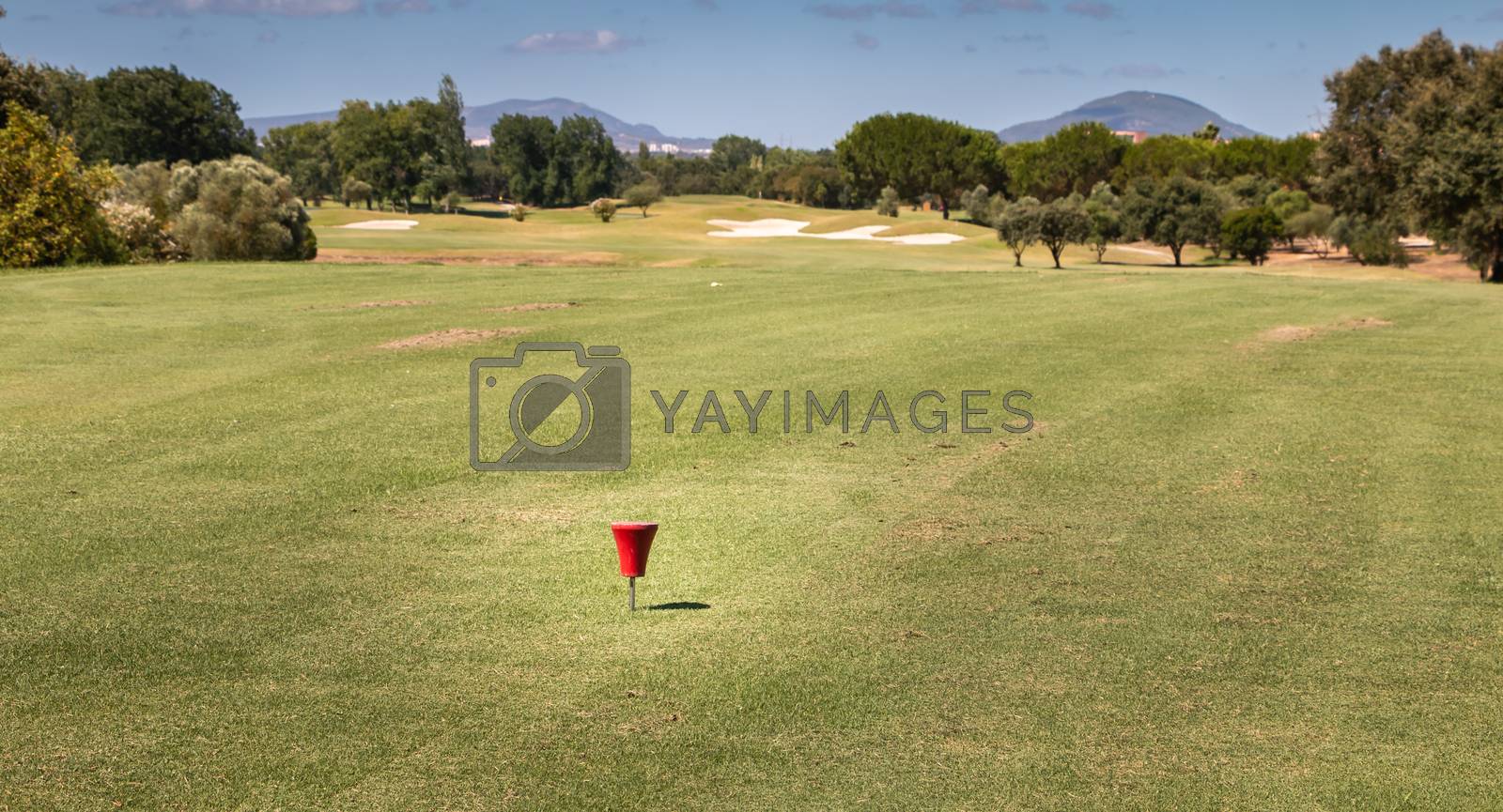 Royalty free image of red marker starting on a golf course by AtlanticEUROSTOXX