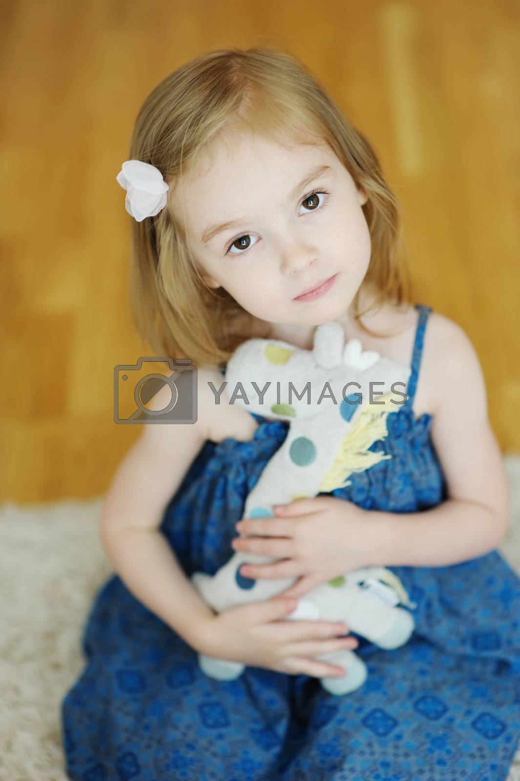 Royalty free image of Cheerful child with a toy by maximkabb