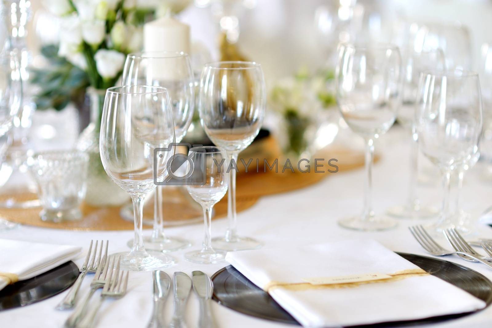 Royalty free image of Table set for an event party or wedding reception by maximkabb