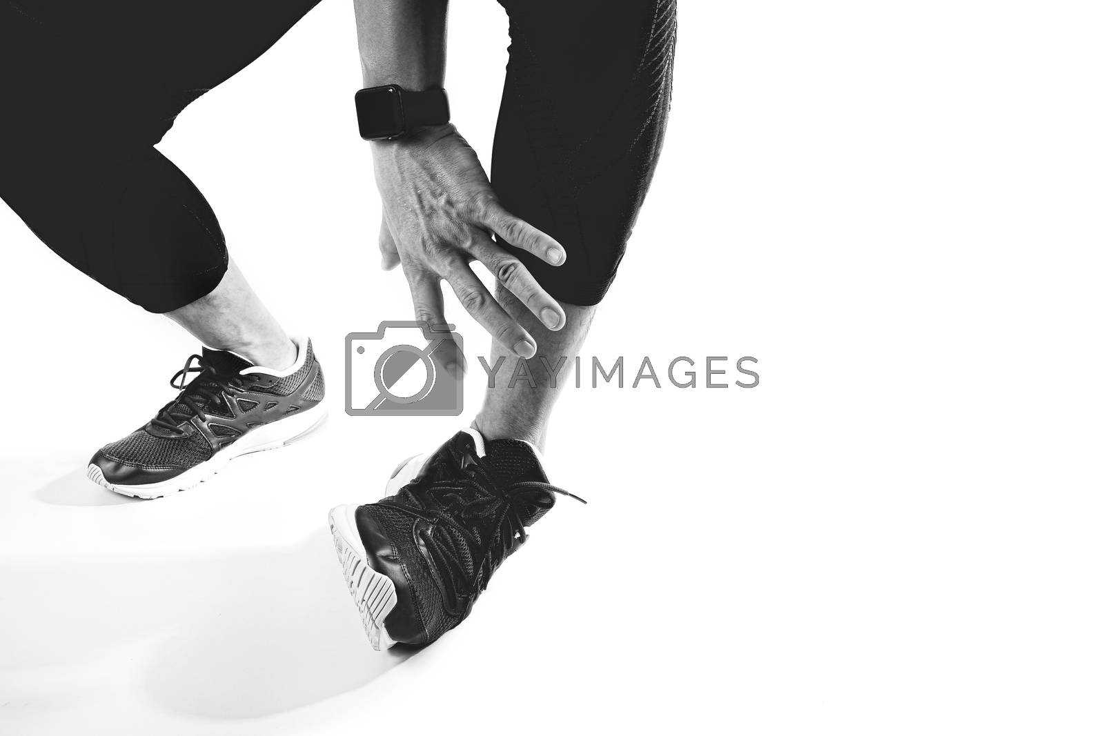 Royalty free image of Runner sportsman holding ankle in pain with Broken twisted joint by everythingpossible