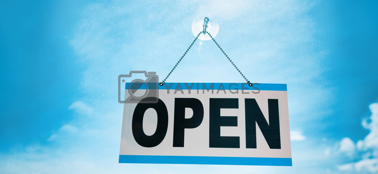 Royalty free image of COVID-19 end of confinement stores reopening with OPEN sign hanging on window store front banner background. Retail businesses opening for non essential services by Maridav