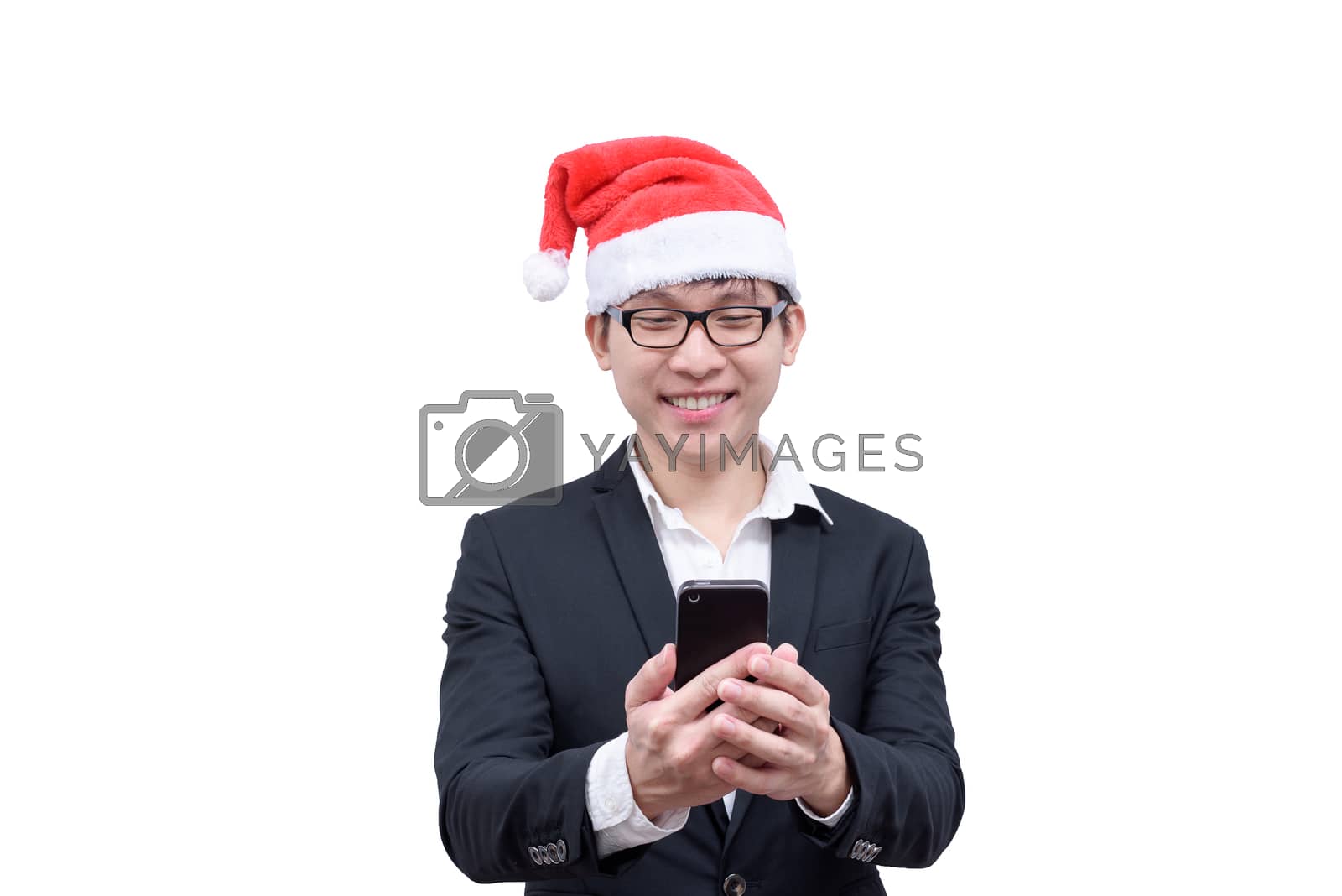 Royalty free image of Business man has mobile playing with Christmas festival themes i by animagesdesign