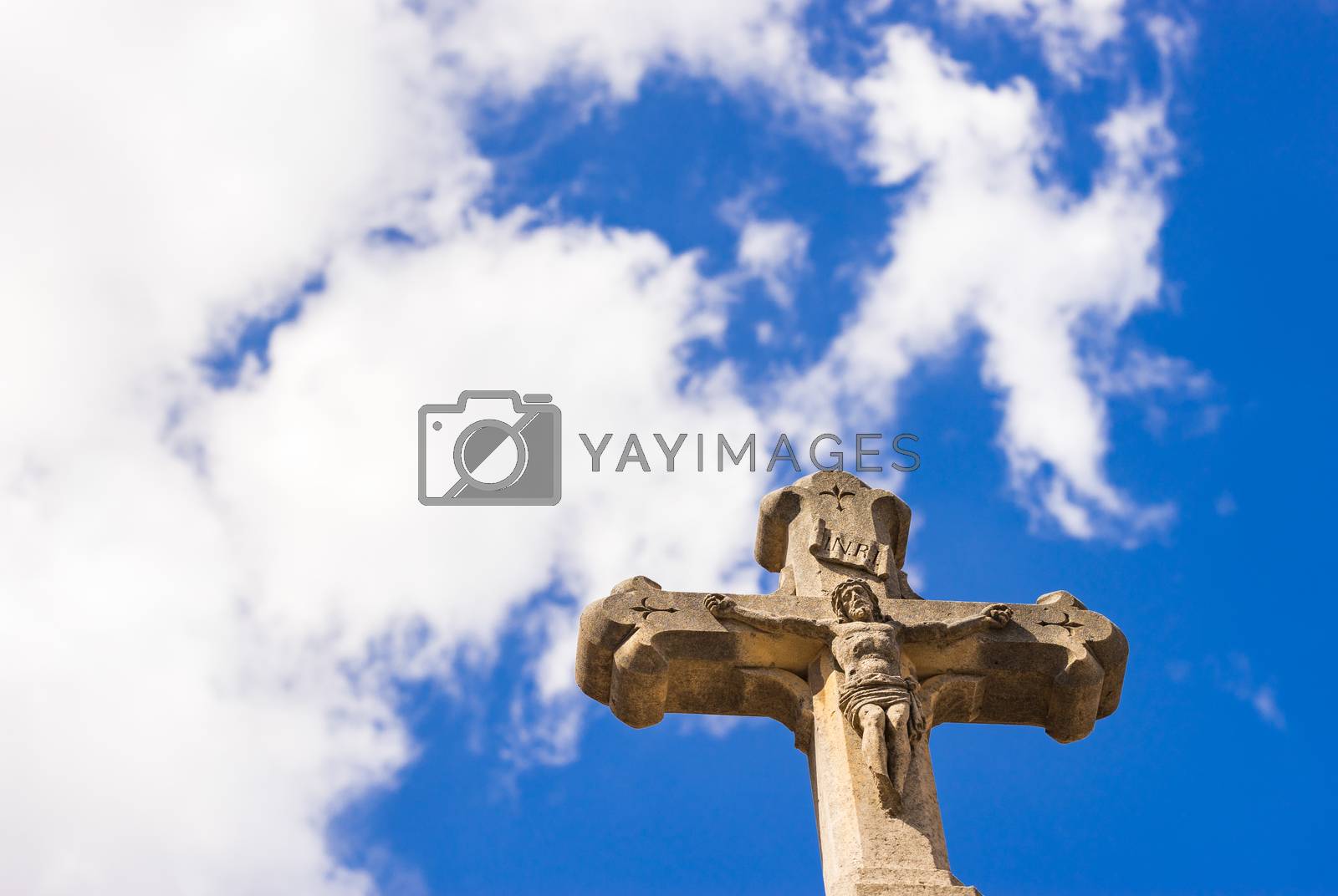 Royalty free image of Cross against blue cloudy sky, religion christianity concepts background by Vulcano