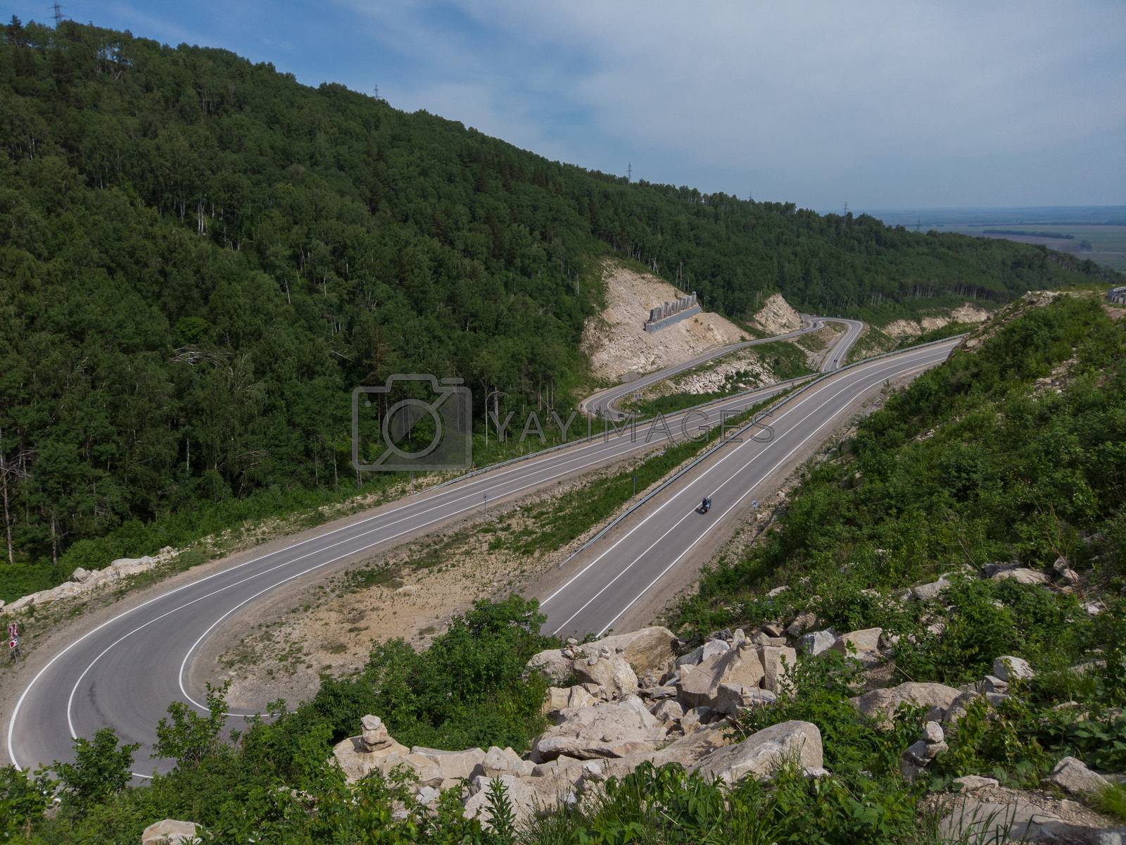 Royalty free image of Aerial top vew of winding road in the mountains by rusak