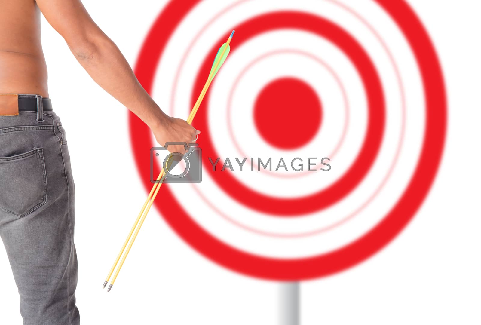 Royalty free image of Asian man holding bow and shooting to archery target. Rear view, by nnudoo