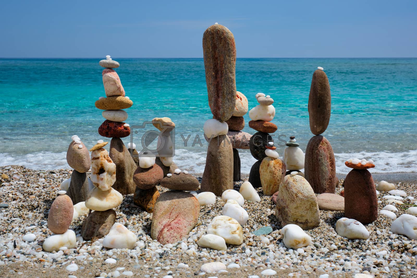 Royalty free image of Concept of balance and harmony - pebble stone stacks on the beach by dimol