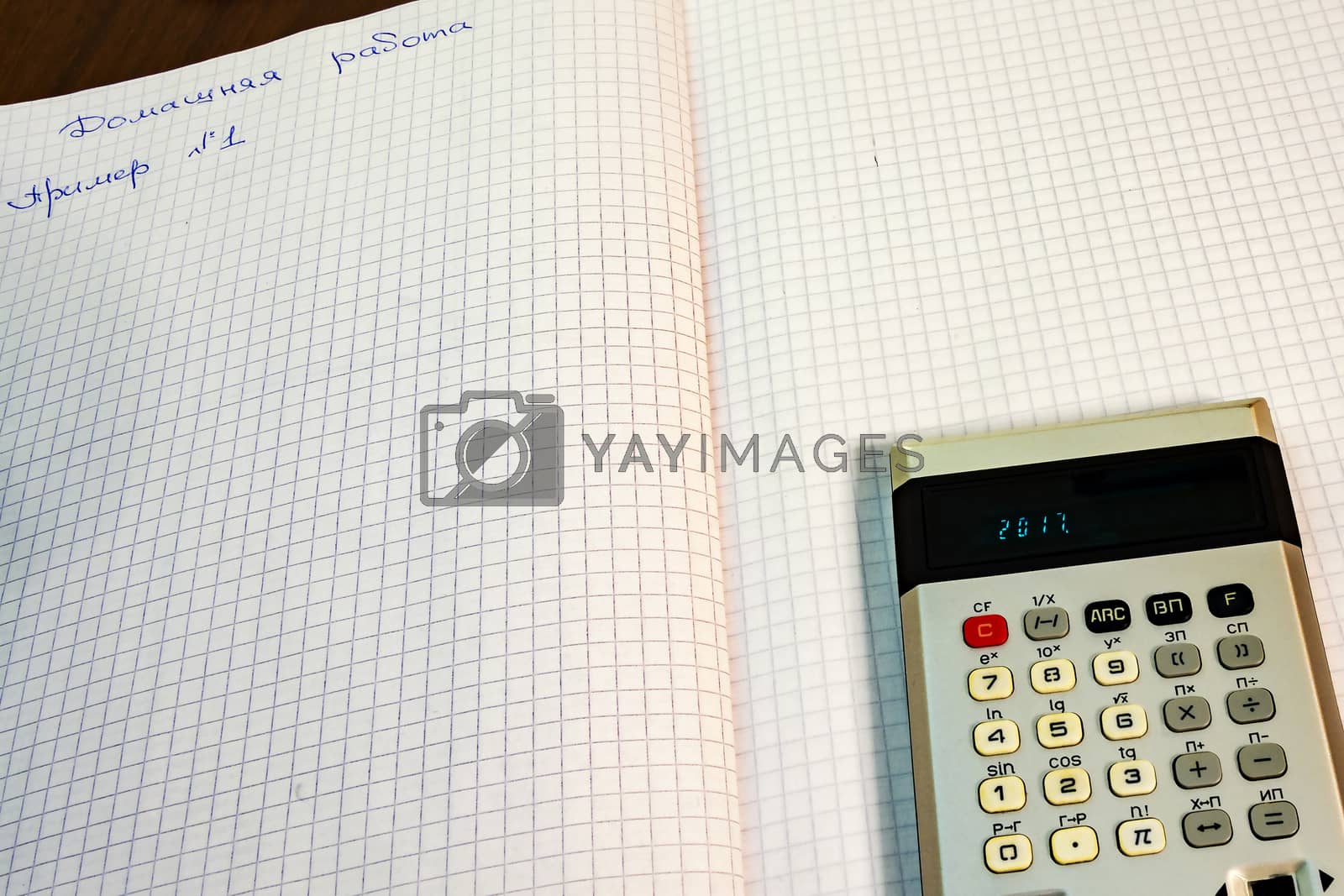 Royalty free image of The pages open notebook lay calculator by Grommik