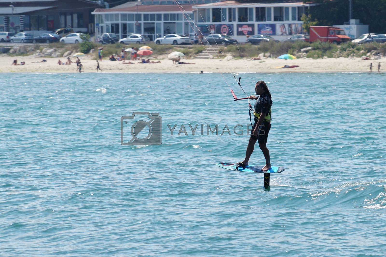 Royalty free image of a man is kiting the sea against the background of the beachVarna by Annado