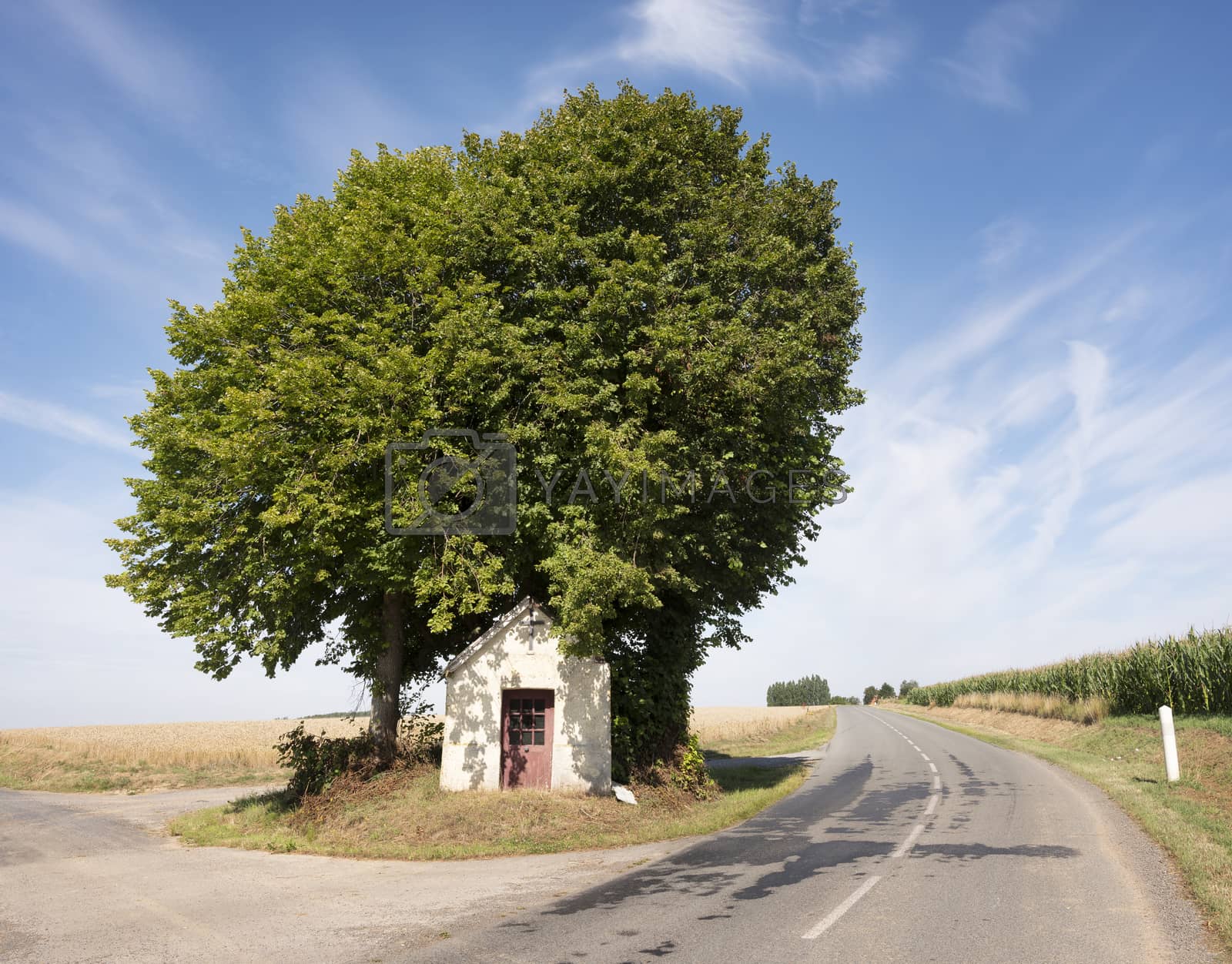 Royalty free image of small roadside chapel in northern france by ahavelaar