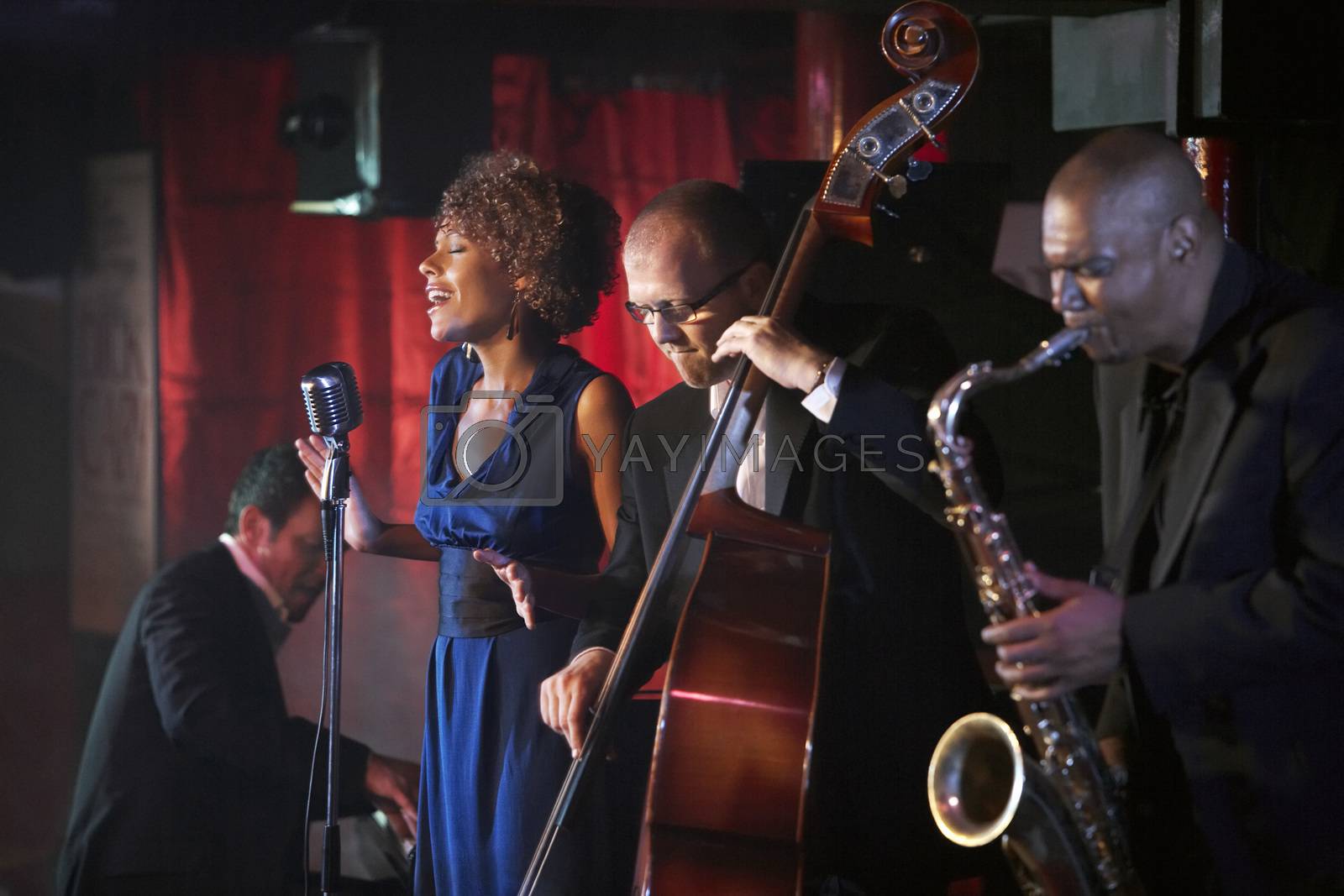 Royalty free image of Jazz band performing in nightclub by moodboard