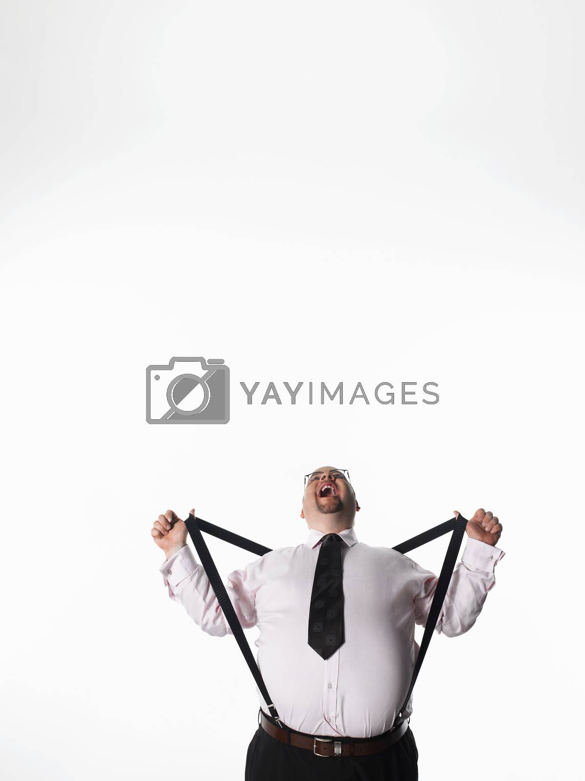 Royalty free image of Overweight businessman stretching braces by moodboard