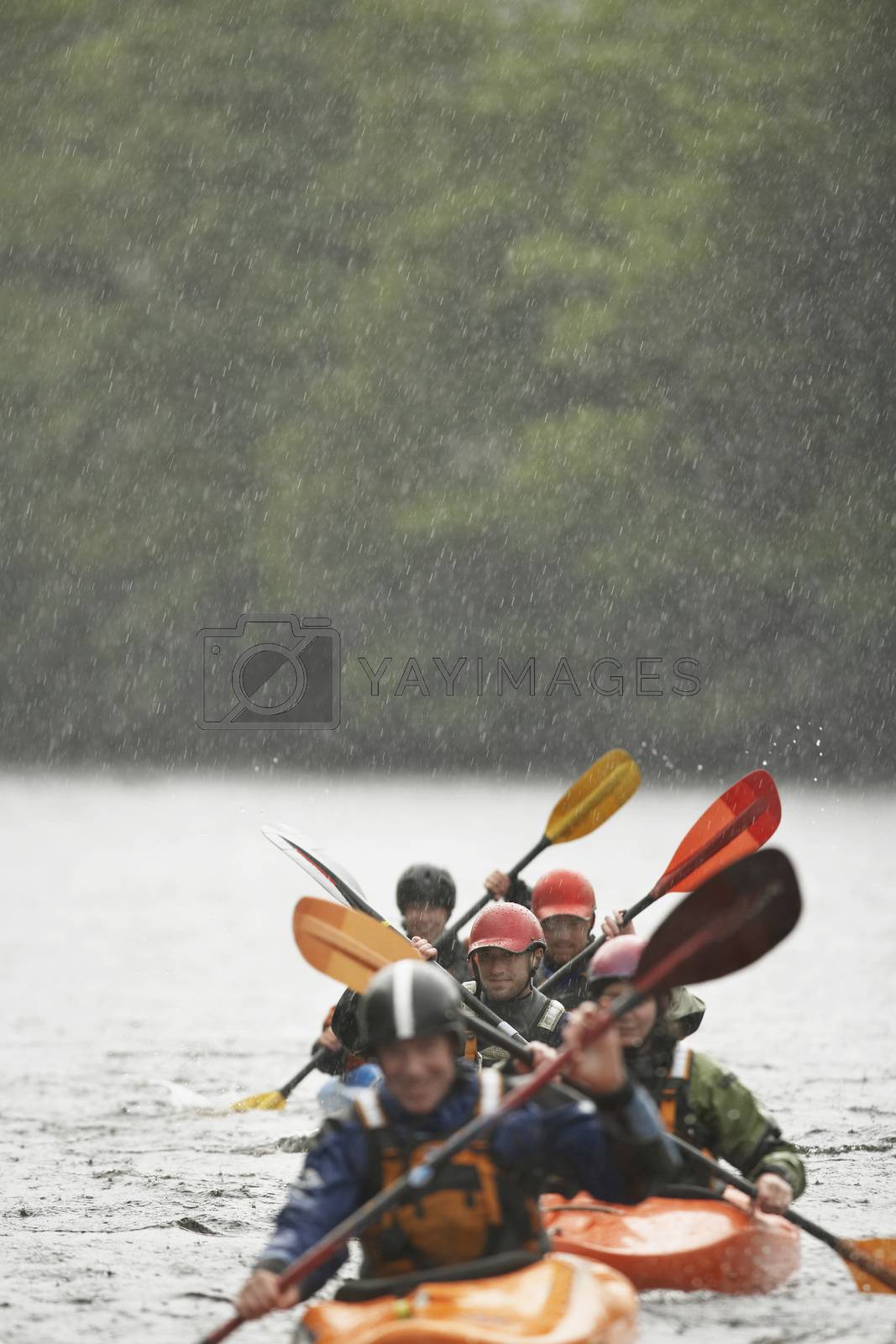 Groupof people kayaking in river