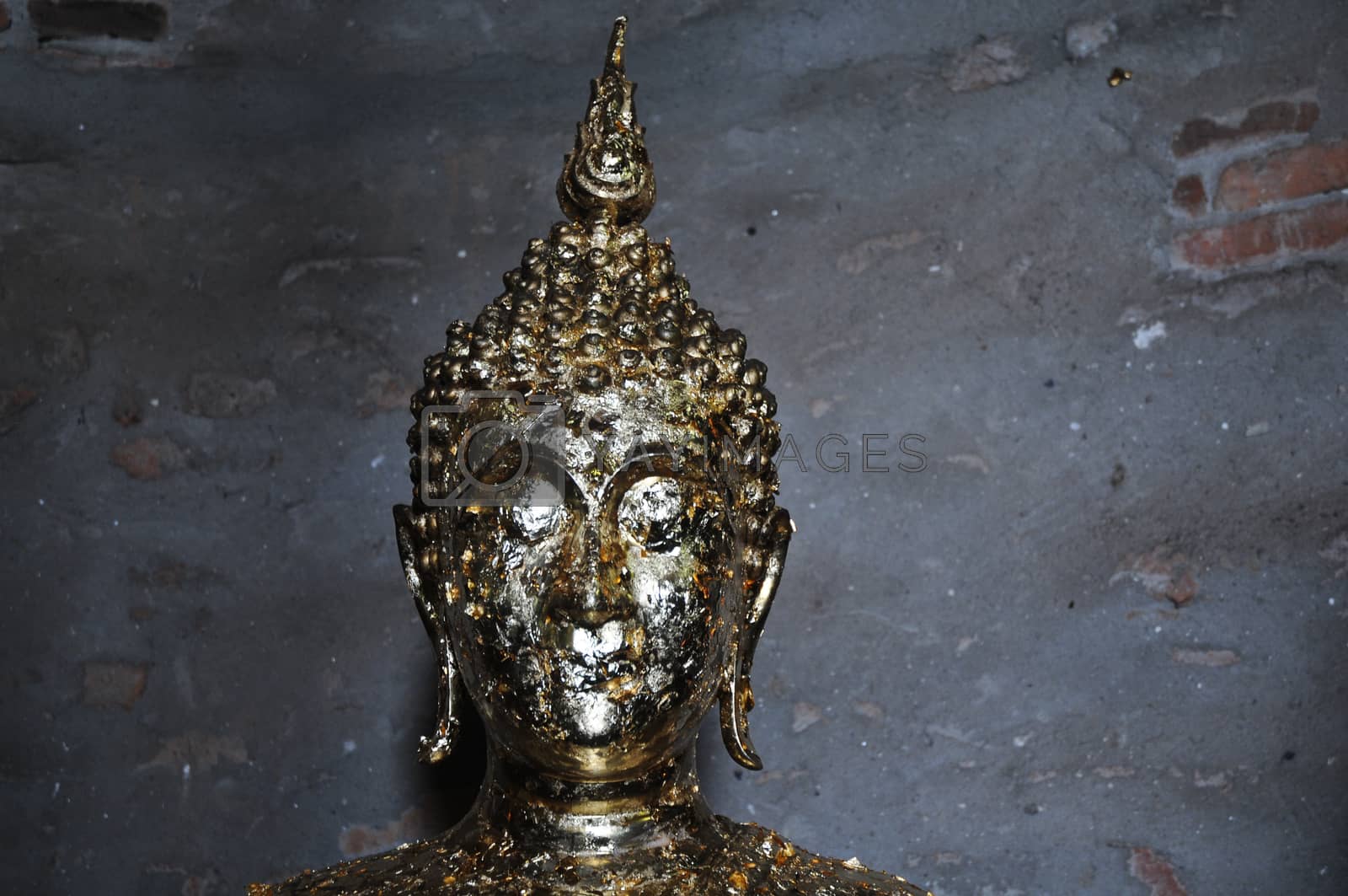 Royalty free image of Golden Buddha statue face by eyeofpaul